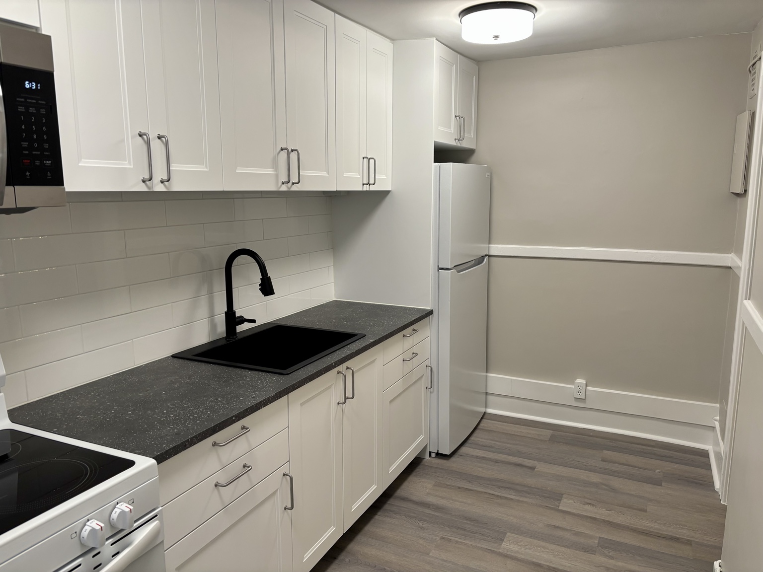 Kitchen cabinetry, sink and refrigerator — 430 Giles Blvd W., Windsor, Ontario