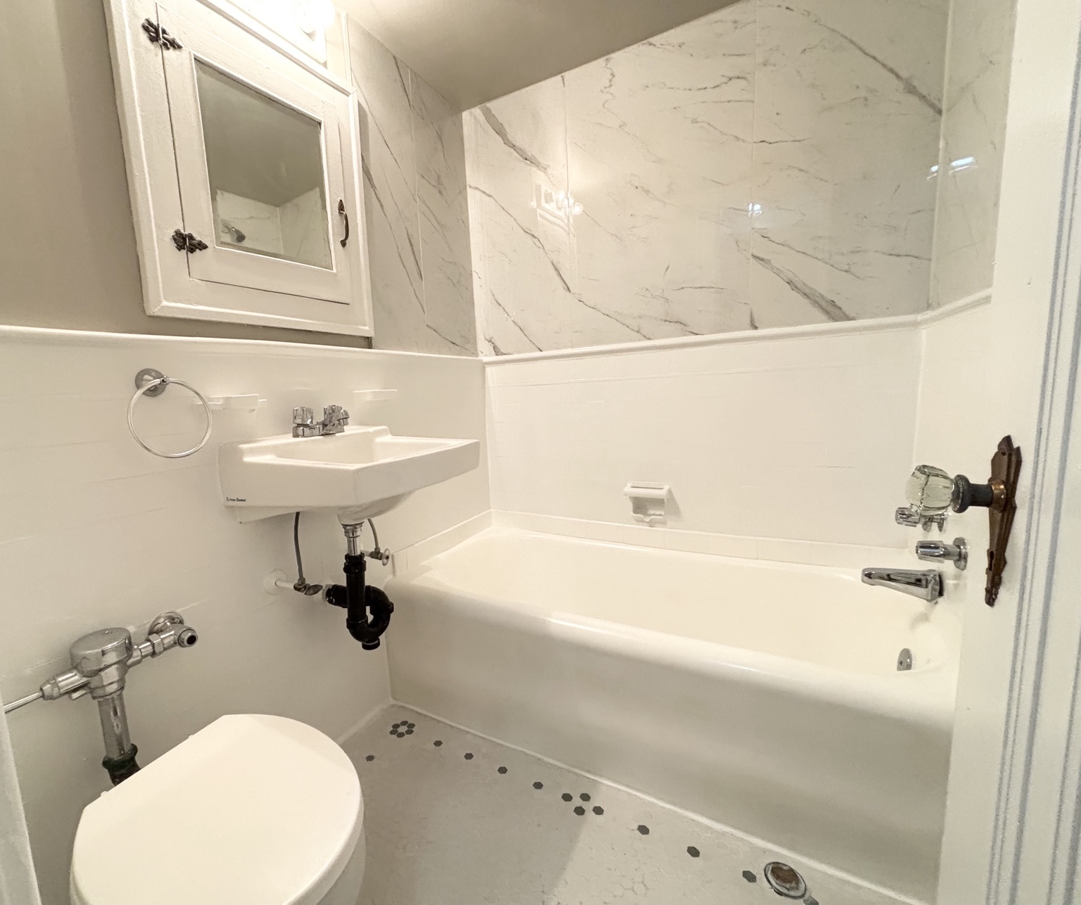 Bathroom with bathtub, shower surround and wall-mounted sink — 430 Giles Blvd W., Windsor, Ontario