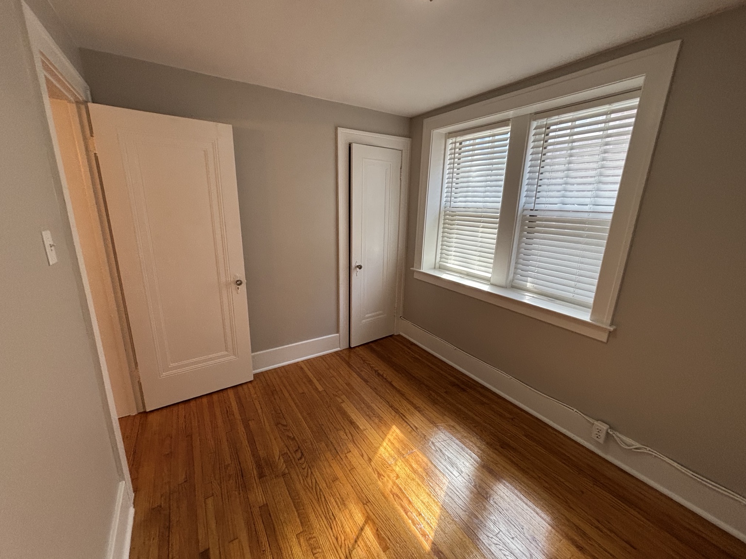 Bedroom with hardwood floor and double window — 430 Giles Blvd W., Windsor, Ontario